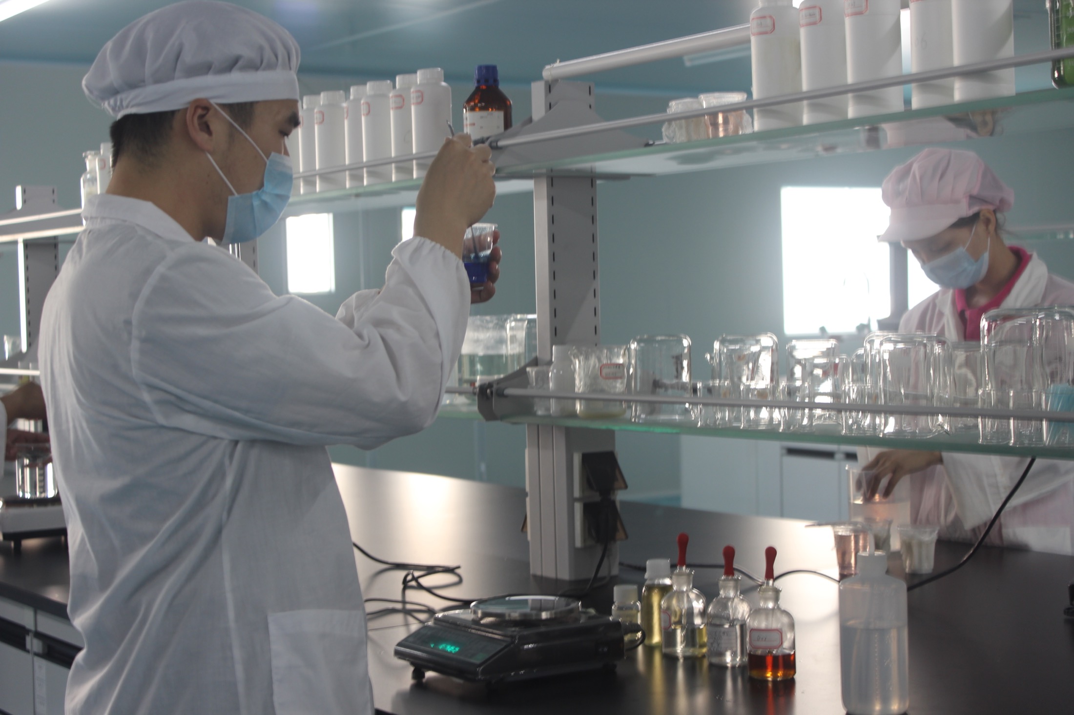 Momei BioTech laboratory team checking cosmetic samples